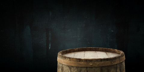 background of barrel and worn old table of wood.