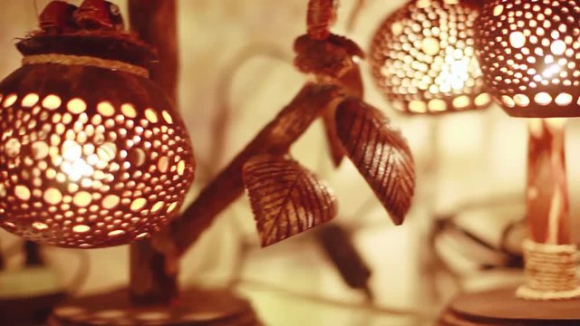 Handcrafted coconut lanterns in street market. 1920x1080