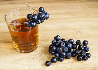 Juice of rowanberry in cup on table