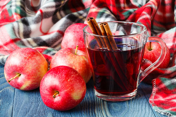 Cozy plaid in fall day with hot alcoholic drink mulled wine