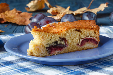 Plum tart with fresh fruit on table