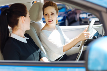 Nice pleasant businesswoman looking at her colleague