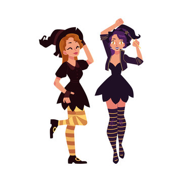 Two pretty girls, women in pointed hats and witch Halloween party costumes, cartoon vector illustration isolated on white background. Two women, girls dressed as witches, Halloween party costumes