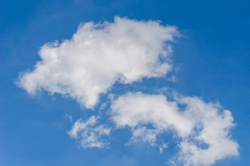 Naklejka na ściany i meble background of cumulus clouds on the blue sky