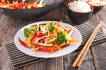 fried vegetable with chopsticks