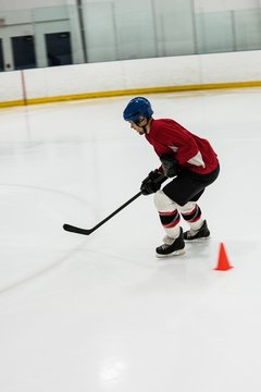 Side view of player playing ice hockey