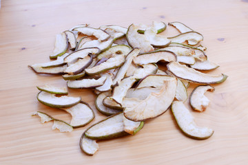 Ripe organic and dried pears on a wooden table, top view.