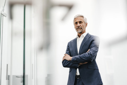 Portrait of confident mature businessman in office