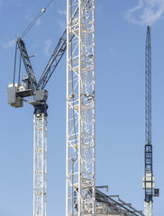 Construction cranes on building site