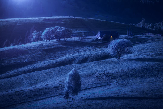 Carpathians village hills iluminated by moonlight