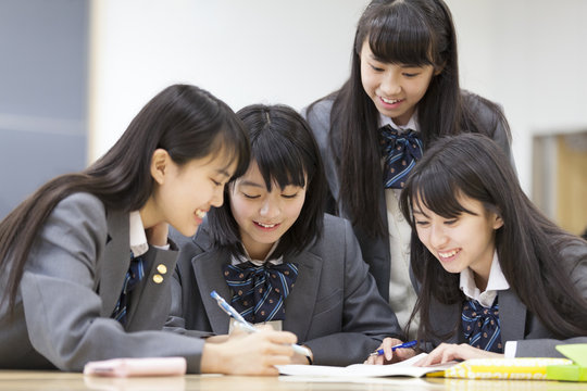 School girls studying together in the classroom