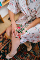 The bride is preparing for the wedding day in the morning, bride's in front of the mirror. 