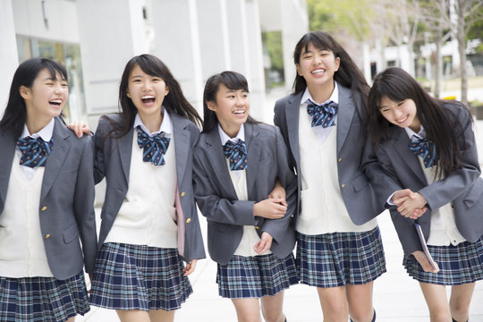 High school girls walking happily