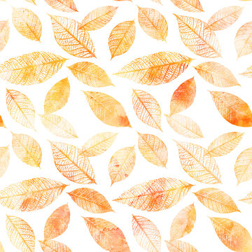 Seamless background pattern of golden tinted watercolor leaves