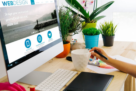 desk with computer and pen tablet web design - Powered by Adobe