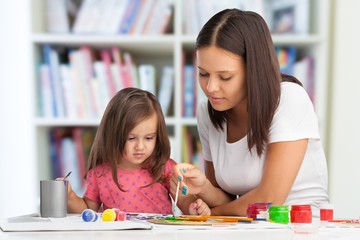 Mother and daughter together paint.