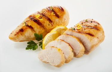 Roasted chicken cut in slices with lemon