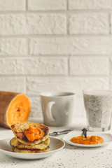 Pancakes with pumpkin jam - breakfast in light colors