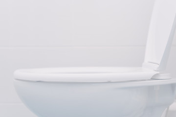 Naklejka na ściany i meble White toilet seat in bathroom