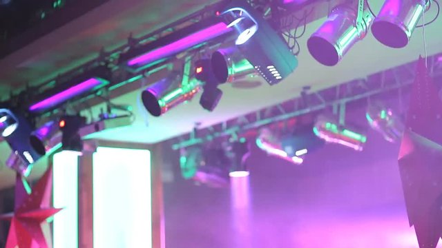 multicolored searchlights in a nightclub at a New Year's party