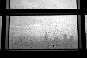 Black and white rain drops on a window