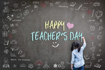 Happy Teacher's Day greeting for World teachers day concept with school student back view drawing doodle of of learning education graphic freehand illustration icon on black chalkboard