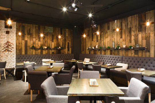 Cozy wooden interior of restaurant, copy space