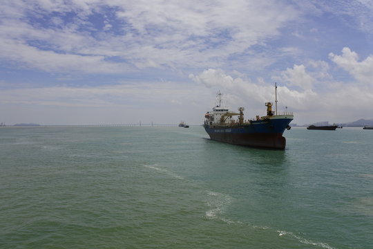 A ship was docked in front of Penang Bridge, Penang, Malaysia