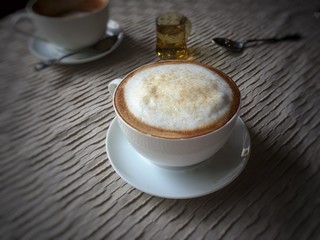 the coffee cup put on table ,in vintage tone
