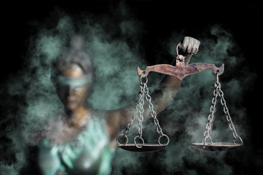 Lady Justice shows the Scale of Justice through fog (Concept of hoping in Justice)