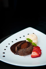 Molten chocolate lava cake strawberry or Fondant on white plate