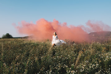 Bride running with red smoke