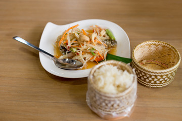 Som Tum papays salad table with sticky rice