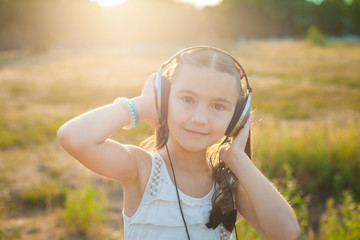 Satisfied girl listening music with headphones