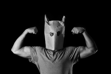 Photo of man with a paper bag on his head
