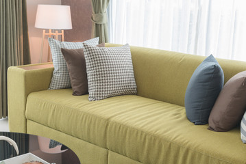 set of pillows on modern sofa in modern living room