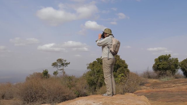 A Woman Tourist Stands And Takes Pictures Of The Opened Panorama