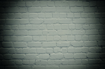 Brick wall with dark edges (as an abstract gloomy background), retro style