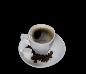 White cup of coffee with beans and sugar cubes isolated on black background