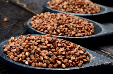 buckwheat in spoon on table