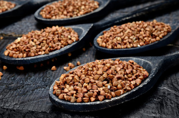 buckwheat in spoon on table