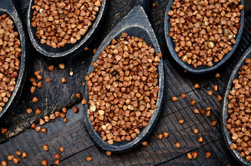 buckwheat in spoon on table