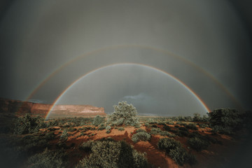 Scenic view of rainbows over landscape