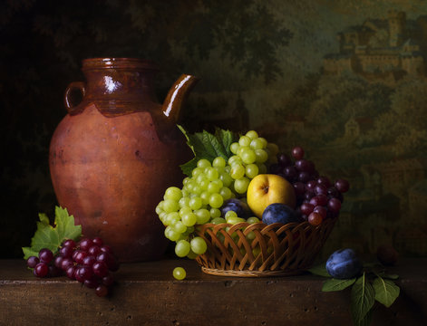 Still life with grapes, pears and plums