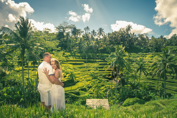 Naklejka premium Happy couple traveling at Bali, rice terraces of Tegalalang, Ubud