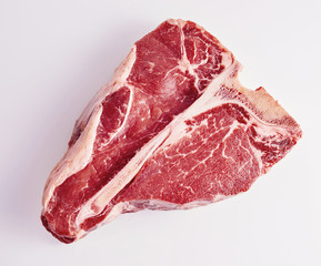 Prime cut tender raw t-bone steak for a BBQ