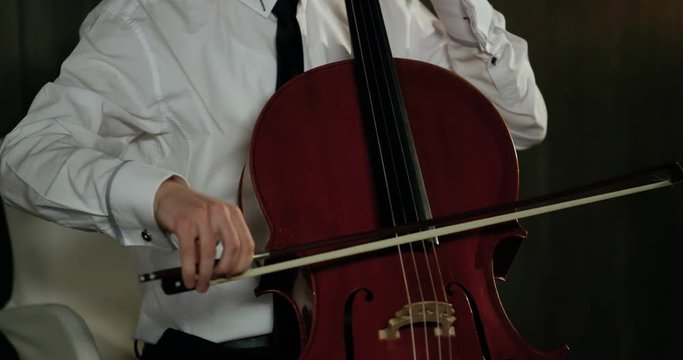 Violinist Plays Beautifully At The Romantic Diner 4K. Detail from hand to face. Red Epic