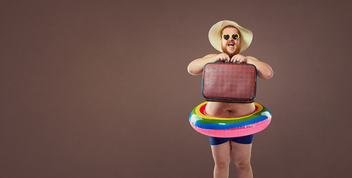 Funny bearded man prepared for beach vacation