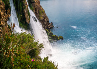 Amazing huge waterfall falls into the blue sea. Turkey.