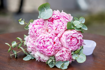 Wedding bouquet of peony flowers. The concept is a holiday, a wedding, marriage, a ceremony.